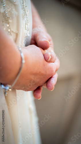 Closeup photo of hands folded together in prayer
