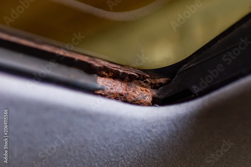 Fényképezés Close-up of car body corrosion near the windshield seal