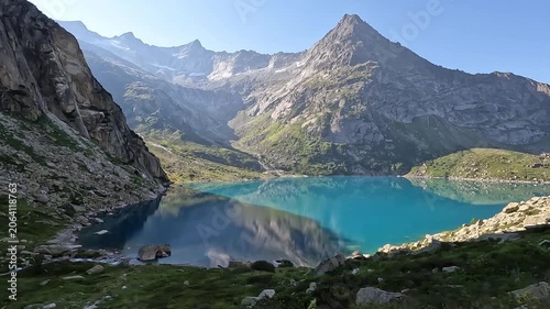 Panoramic View of Turquoise Alpine Lake Gelmersee and Dramatic Swiss Alps Mountain Peak Switzerland