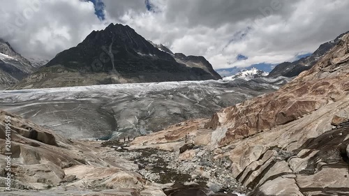 Aletsch Glacier Surface Level View with Rocky Moraine and Alpine Peaks in Valais Switzerland