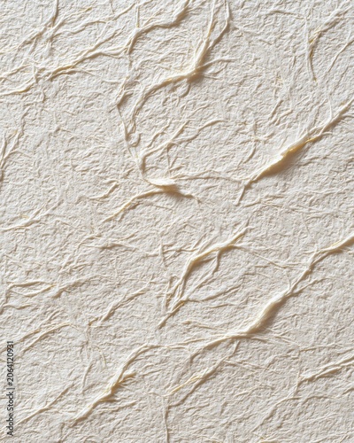 A subtle, textured background resembling handcrafted, crinkled paper with a natural, organic feel, ideal for artistic or design projects