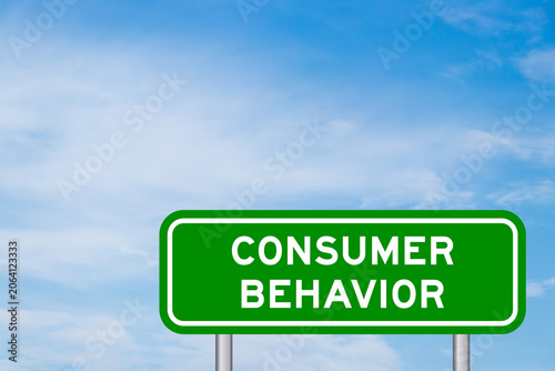 Green color transportation sign with word consumer behavior on blue sky with white cloud background
