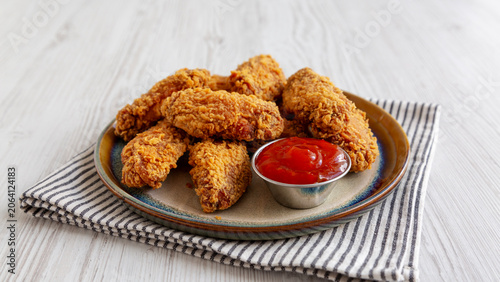 Spicy Deep Fried Chicken Wings with Sweet Chili Sauce, side view.
