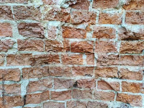 Detail of an old, somewhat unfinished red brick wall
