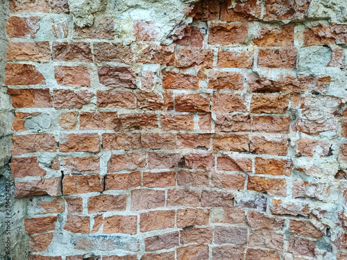 Detail of an old, somewhat unfinished red brick wall
