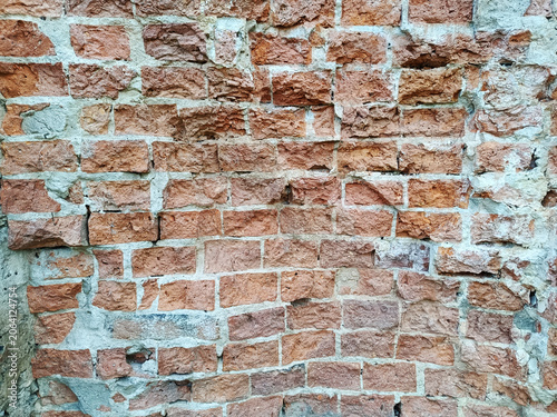 Detail of an old, somewhat unfinished red brick wall