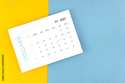 January 2027 calendar page on blue color background, Position with copy space.