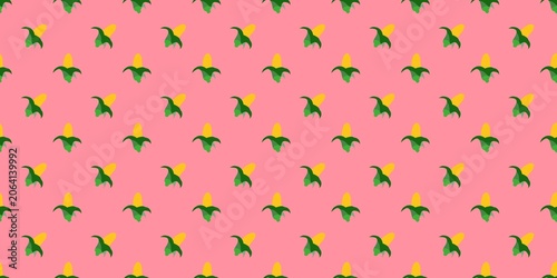 Fotografie Sweet corn cob pattern design on a light pink background.