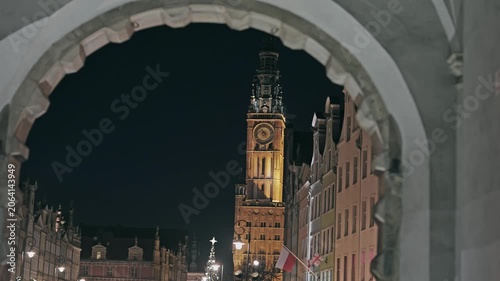 Gdansk Main Town Hall Clock Tower at Night Framed by Arch