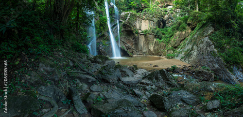 Panoramic beautiful deep forest waterfall in Thailand. nature background.