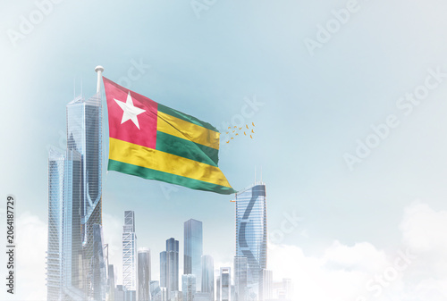Εκτύπωση καμβά Togo flag waving with modern futuristic buildings