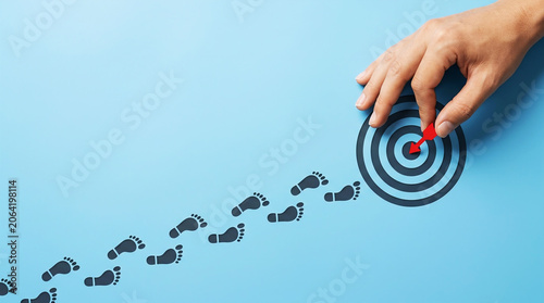 Goal Achievement and Business Success Concept with Target Focus Strategy Planning and Career Growth Journey on Blue Background