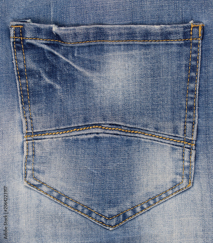 Blue jeans texture: pocket and yellow stitching detail