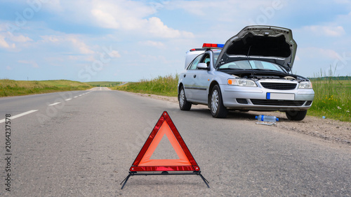 Photos Broken Down Car on a Country Roadside with Warning Triangle