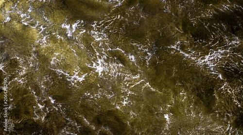 Golden metallic texture of Venetian plaster with Malachite effect'Opus with streaks of silver-white marble.