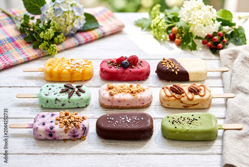 Colorful Ice Cream Pops on Bright Summer Background
