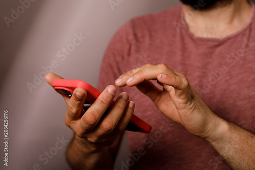 Man's hands are actively en...