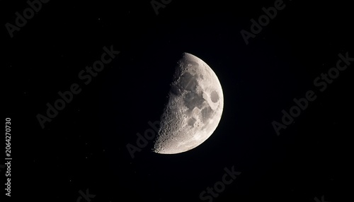 close up on waxing crescent moon on night sky