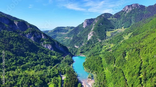 4K Drone Flight Above Turquoise Mountain Lake and Forested Valley