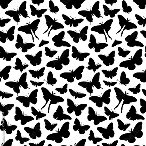 Seamless pattern with black butterfly and moth silhouettes on a white background