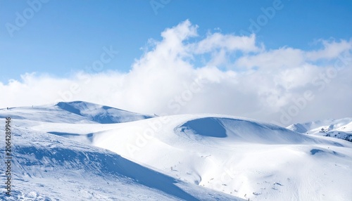 Snowy mountain landscape under blue sky