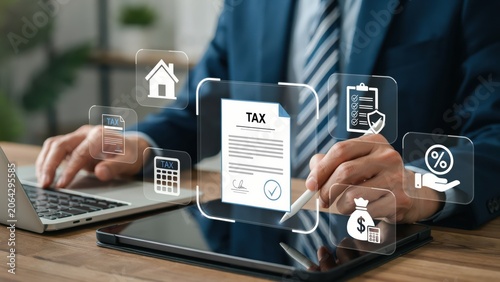 Businessman using laptop with digital tax form and financial icons in an office