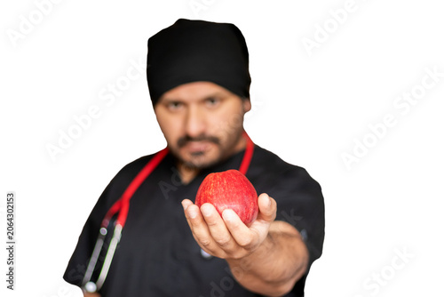 Horizontal view of a medical worker offering an apple for a healthy lifestyle