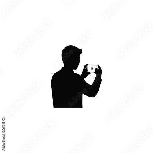 Silhouette of a man holding a smartphone horizontally to take a photo or record a video. Modern technology, social media, digital communication, and mobile photography icon on white background.
