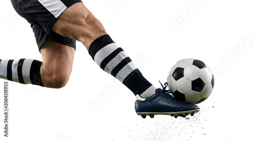 Athletic Soccer Player Kicking Ball in Black and White Uniform