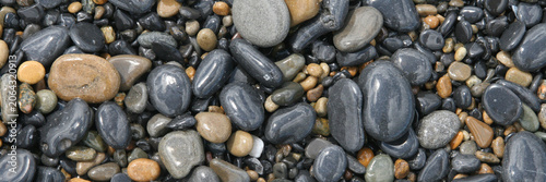 Valokuva Natural Pebble Stone Background Texture in Vertical Format