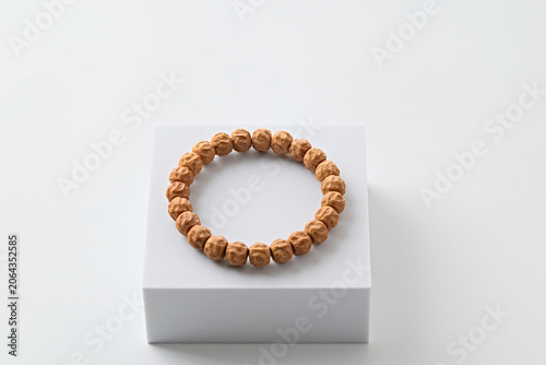Smooth Polished Barrel Bead Natural Wrist Bracelet on White Minimalist Display Platform
