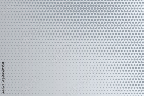 фотографія Gray halftone pattern with gradient, circular dots arranged in a grid on a light