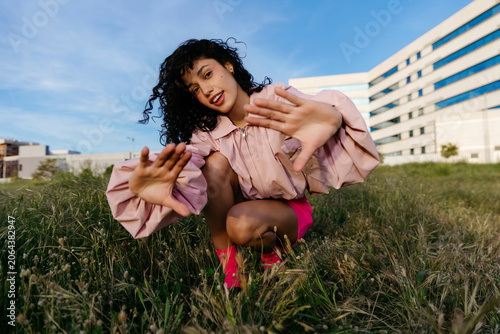 Woman posing in grass 