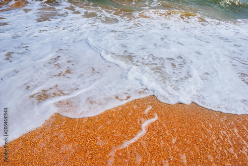 Canvas Print closeup sandy sea beach with waves, natural summer sea background