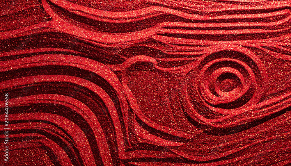 Fototapeta premium Stunning abstract background featuring textured red glitter sculpted into zen garden waves and a circular spiral, ideal for luxury holiday designs, love themes, and festive backdrops.