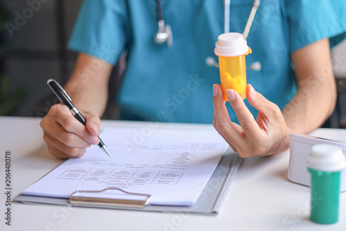 Bild auf Leinwand Doctor or authorized medical professional orders a specific medication for a patient to treat an illness or injury