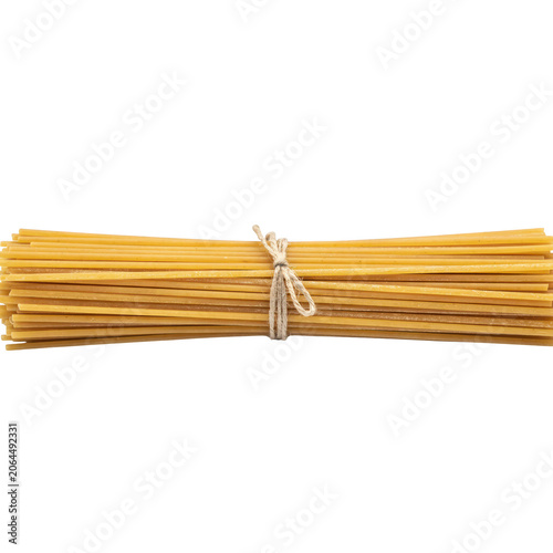 A bundle of raw dry spaghetti pasta strands tied together with a piece of twine isolated against a solid black background, for food usage