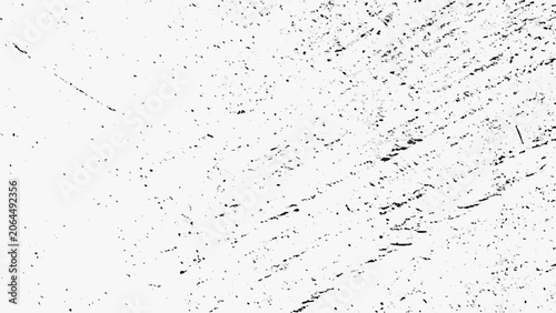Картината върху платно Distressed texture with scattered black specks on a white background a subtle gr