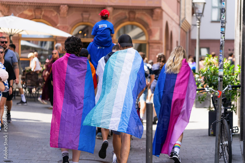 Fotografie Participants wearing bisexual and transgender pride flags during CSD march