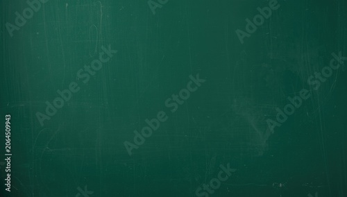 Green chalkboard with scratches and marks
