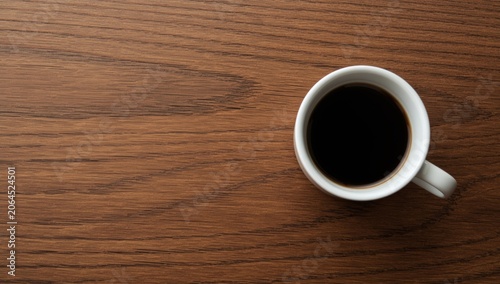 Coffee cup filled with black coffee on a wooden table