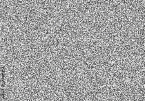 Close-up texture of fine silver glitter particles spread evenly on a flat surface during bright studio lighting