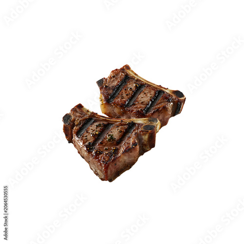 Two grilled lamb chops with grill marks seasoning