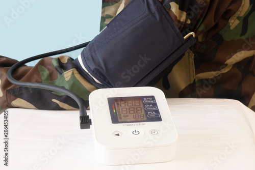 Photos Veteran Taking Blood Pressure Reading Shows High Systolic and Diastolic Numbers