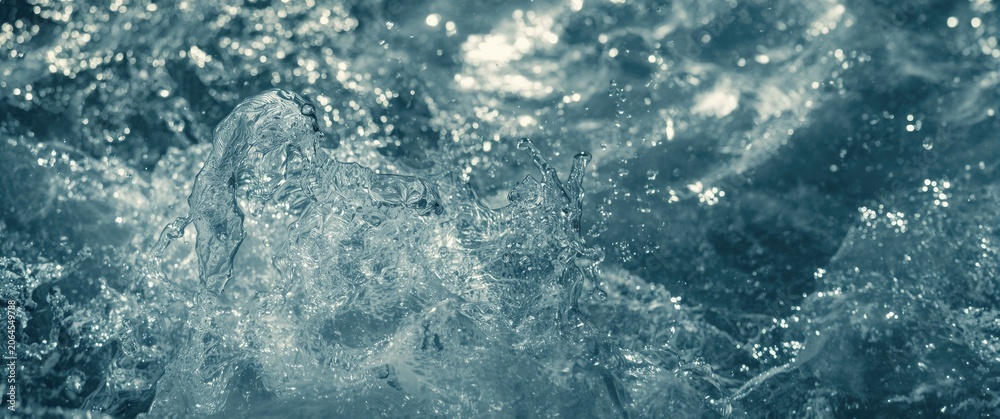 Obraz premium Abstract water splashes and bubbles in a blue tone