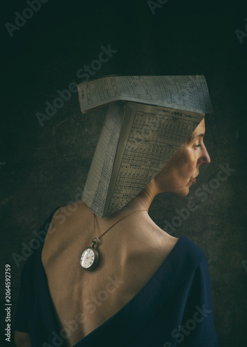 artistic portrait of a woman with a paper hat made of calendars IV