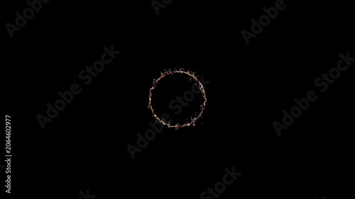 bright orange flame burning intensely on dark rocky surface with smoky atmosphere creating dramatic powerful visual effect glowing embers intense burning circle of fire and smoke