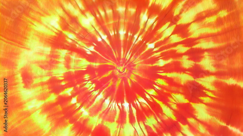 Abstract tie dye pattern with vibrant pastel and neon colors in a radial burst design, creating a psychedelic artistic background with textured fabric effect.