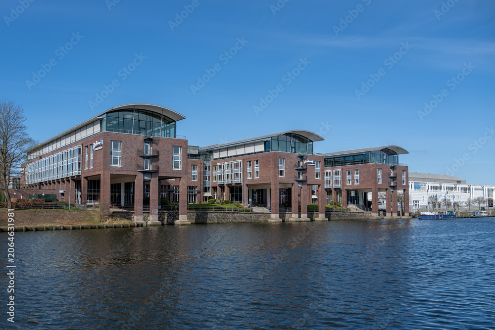 Obraz premium Modern riverside hotel building on River Trave, Lübeck