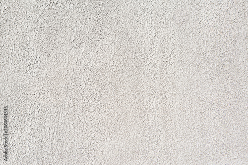 White plaster wall texture with subtle rough pattern and decorative finish. Clean architectural background suitable for design, construction, renovation, and graphic projects.